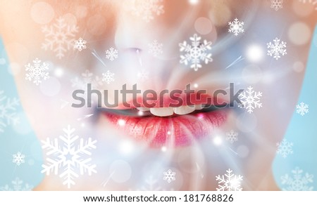 Pretty woman mouth blowing cold breeze close up