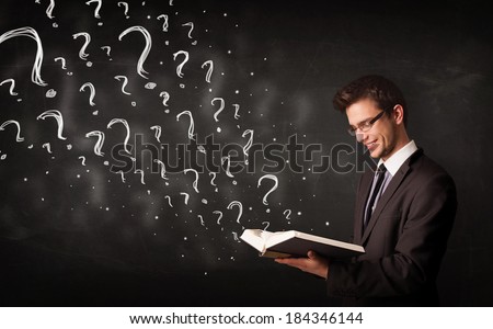 Confused man reading a book with question marks coming out from it