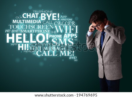 Young man in suit making phone call with word cloud