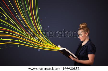 Young woman reading a book while colorful lines are coming out of the book