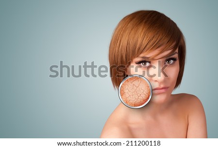 Healthy beautiful young girl with magnifying glass of skin damage