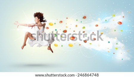 Beautiful woman jumping with colorful gems and crystals on the background concept