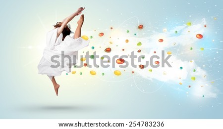 Beautiful woman jumping with colorful gems and crystals on the background concept