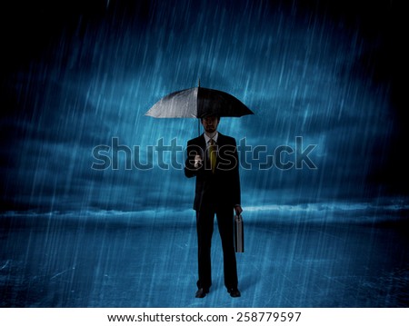 Business man standing in rain with an umbrella concept on background