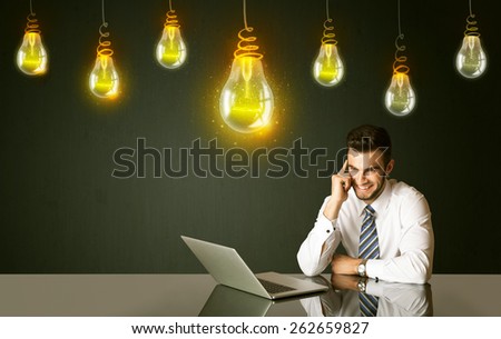 Businessman sitting at the black table with idea bulbs on the background