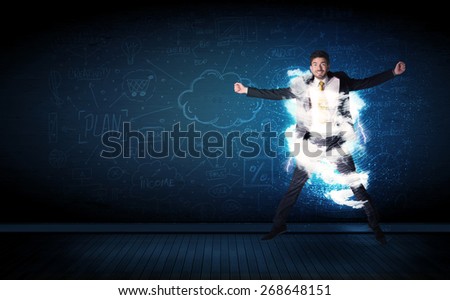 Happy business man jumping with storm cloud around him concept