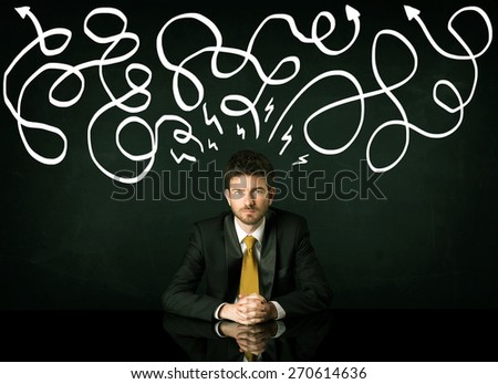 Depressed businessman sitting under white drawn direction lines