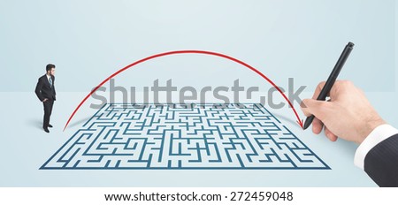 Business man in front of hand drawn maze thinking how to get through