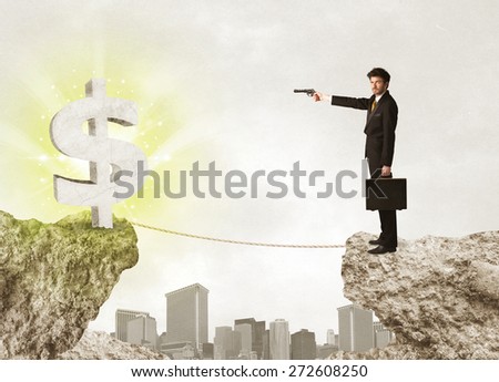 Businessman standing on the edge of mountain with a shining dollar mark on the other side