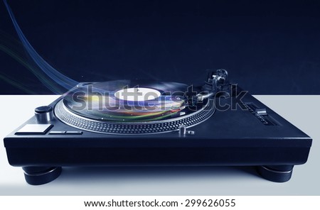 Music player playing vinyl music with colourful abstract lines concept on background