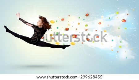 Beautiful woman jumping with colorful gems and crystals on the background concept