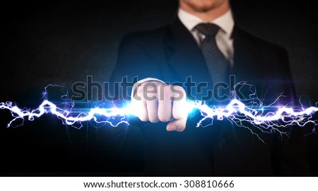 Business man holding electricity light bolt in his hands concept
