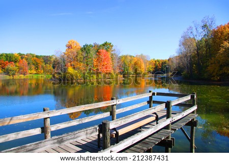Board walk near the lake in autumn time