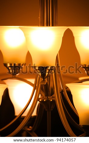 Lamps of brightly lit chandelier lights