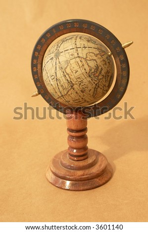 old globe close up on rusty paper background