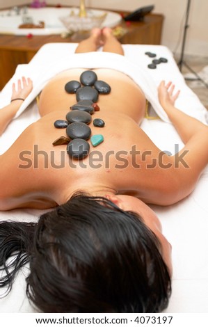 volcanic stone massage session at a spa center