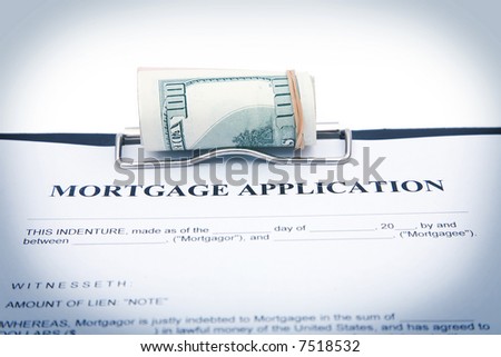 business concept with mortgage application and US dollars