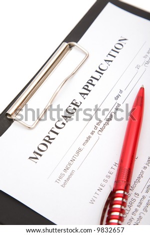 business still life with mortage application form and red pen