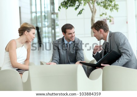 Business people meeting in airport lounge