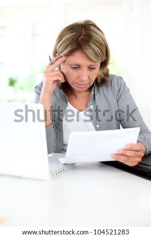 Senior woman having problems understanding official documents