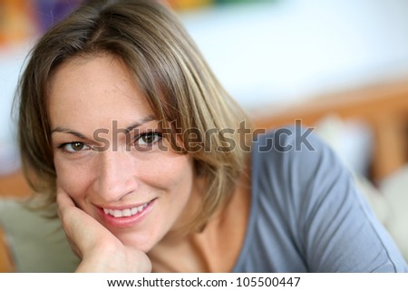 Portrait of middle-aged woman relaxing in sofa