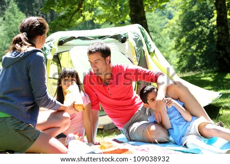 Family doing camping in the forest