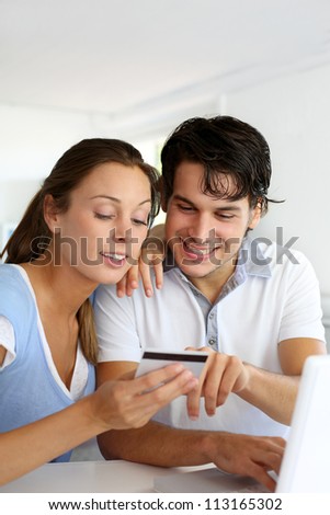 Couple having their pictures developed on internet