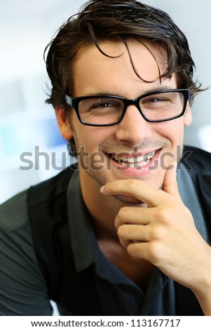 Portrait of handsome young man with glasses