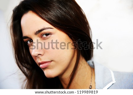 Portrait of young woman with serious expression on her face