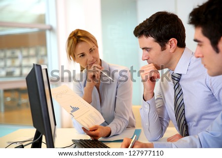 Business team working in front of desktop