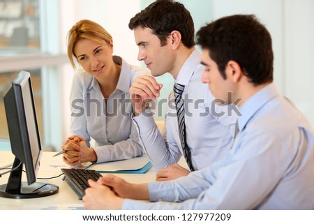 Business team working on front of desktop