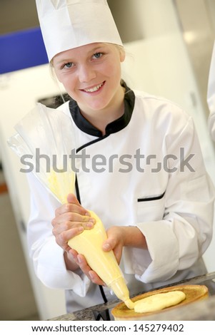 Portrait of pastry cook student girl