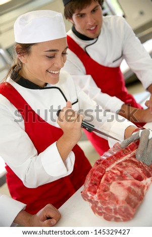 Smiling students in butchery training course