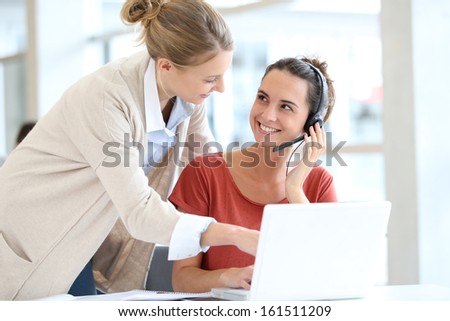 Young women in office working on laptop computer