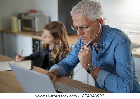 Similar – Image, Stock Photo Father working on laptop while child playing on kitchen floor