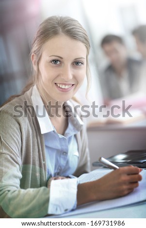 College girl studying with digital tablet