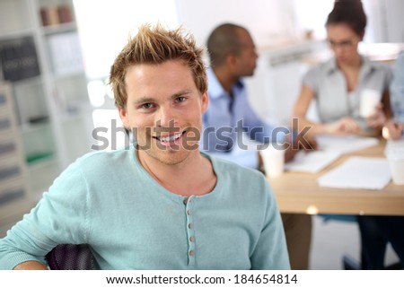 Closeup of young man in business class