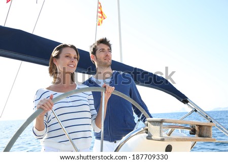 Couple sailing on the mediterranean sea