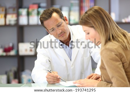 Veterinarian giving medical advice to client