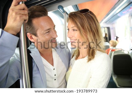People in town taking public transportation