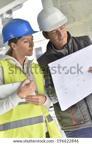 Construction team working on building site