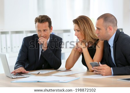 Business people meeting around table