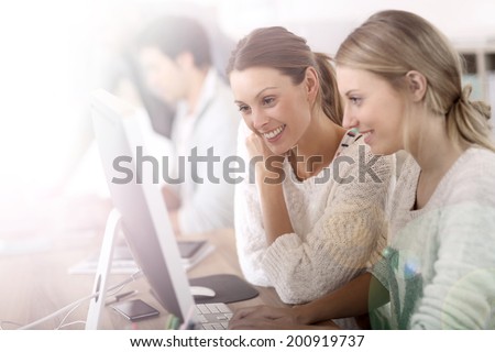 College girls working in front of desktop