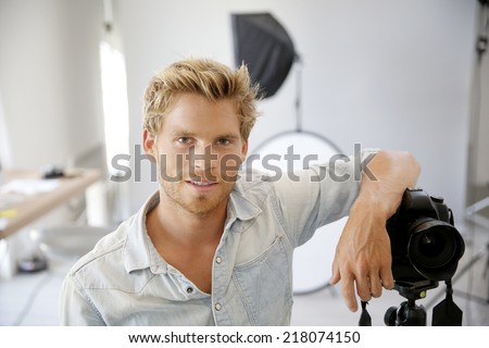Photographer standing in photo studio