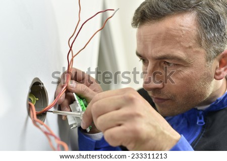 Electrician working on building site