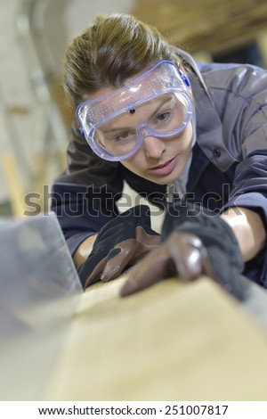 Young woman in carpentry professional training