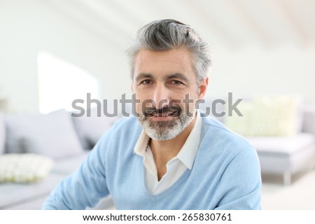 Portrait of handsome mature man with grey hair