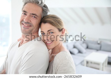 Happy mature couple in brand new home