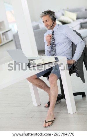 Businessman on video meeting from home in relaxed outfit