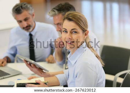 Smiling businesswoman attending work meeting